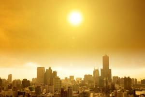 City skyline with bright sun